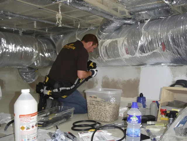 Hudson Air Duct Cleaning specialist performing professional mold removal from air ducts in Hudson