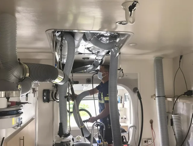 Hudson Air Duct Cleaning specialist performing precise mobile home duct cleaning in Hudson