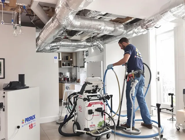 Hudson Air Duct Cleaning technician performing advanced pure duct cleaning with specialized equipment in Hudson