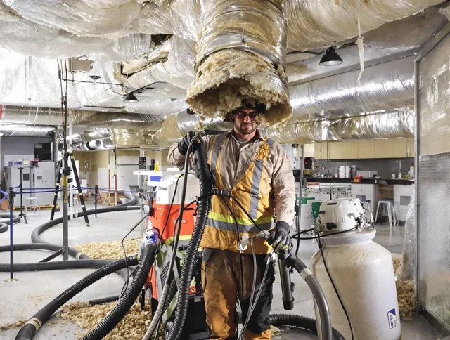 Professional vacuum insulation removal by Hudson Air Duct Cleaning expert in Hudson